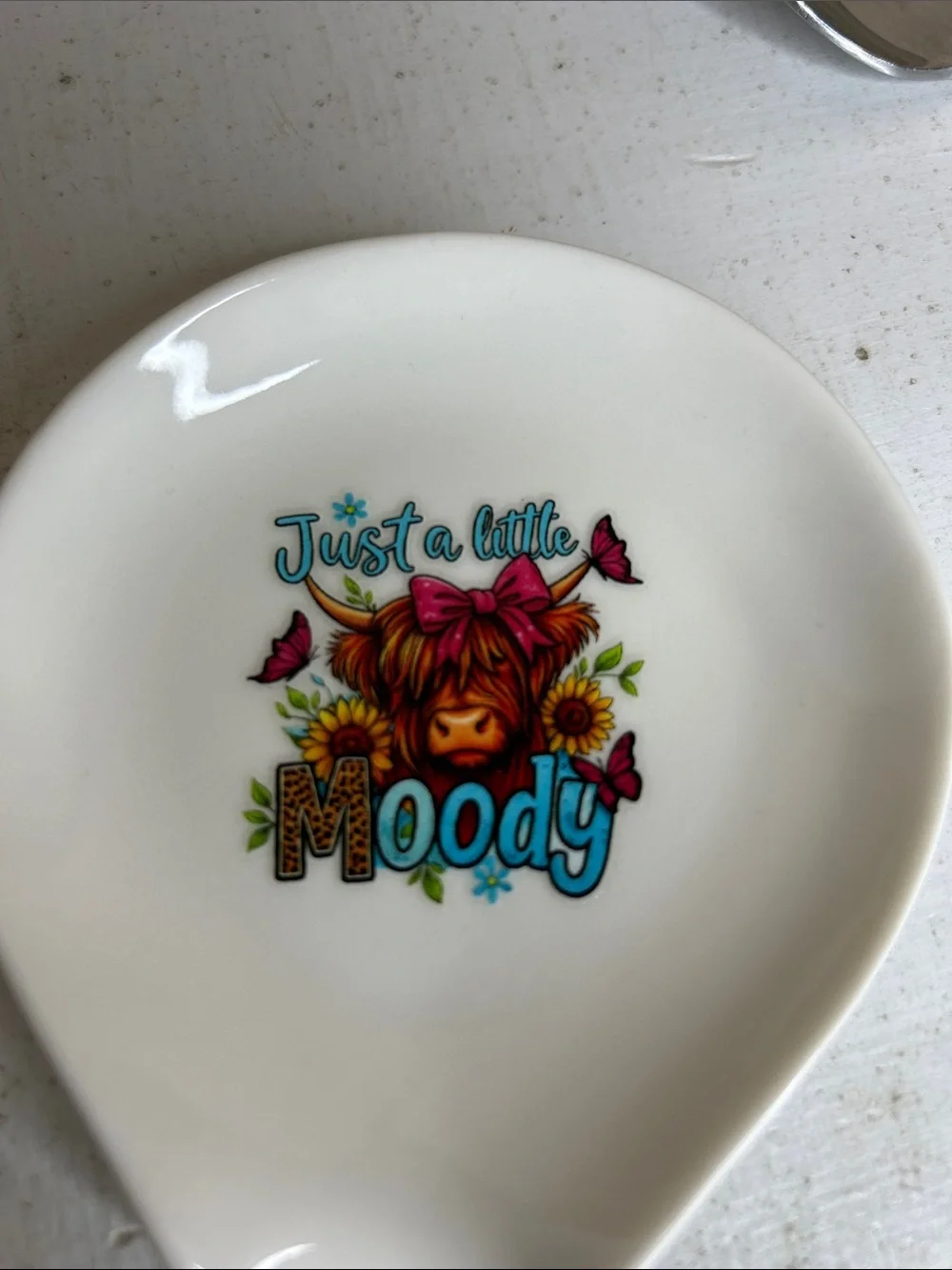 Ceramic Spoon Rest with 'Just a Little Moody' Cow Illustration - White